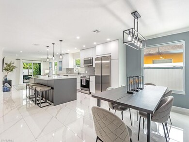 Kitchen featuring a center island, white cabinetry