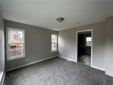 Spare room featuring a textured ceiling, plenty of