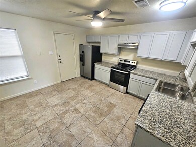Newlly remodeled kitchen with lots of cabinets and