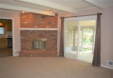 Living Room with Brick Fireplace