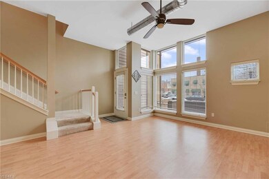 Inside the front door you are welcomed to the Living Room.  Notice the wall of windows.