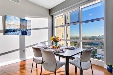 Dining space featuring wood finished floors and ba