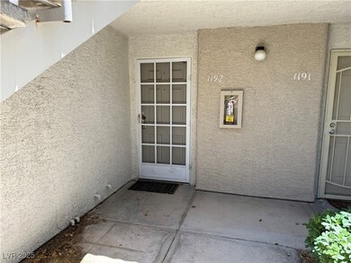 Doorway to property featuring stucco siding