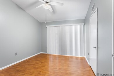 Two Closets ~ Vaulted Ceiling ~ Updated Flooring ~ Ceiling Fan/Light ~ Opens to the Front Porch Balcony