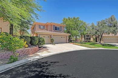 Mediterranean / spanish-style house featuring stucco siding, concrete driveway, and an attached garage