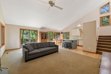 Wall of windows bringing in sunlight and treehouse effect