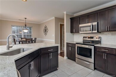 Kitchen opening to breakfast area