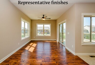 Sunroom with hardwood floor.