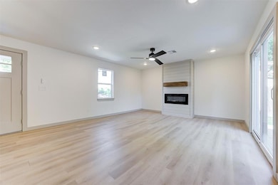 Unfurnished living room with healthy amount of nat