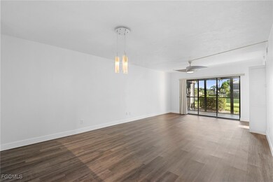 Unfurnished room featuring dark wood-style floors