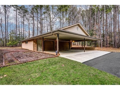 Detached 3 Car Garage with Workshop and Carport!