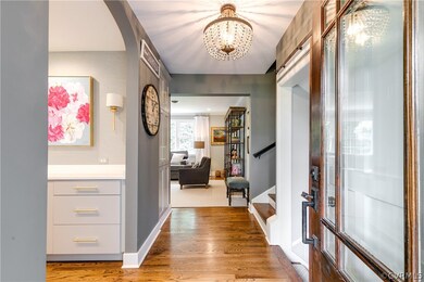 Entry hall connects kitchen, living spaces and all