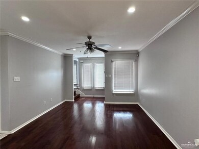 Unfurnished room featuring crown molding, hardwood / wood-style floors, and ceiling fan