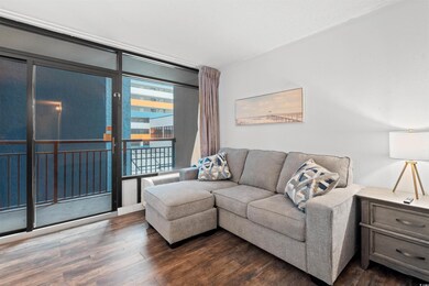 Living area with dark wood-type flooring