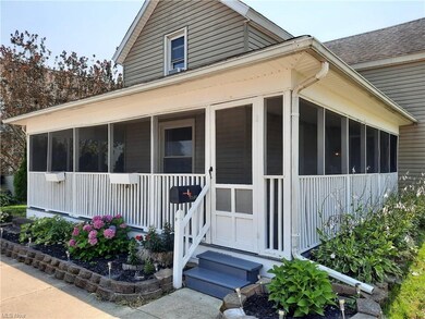 Large covered and screened in front porch
