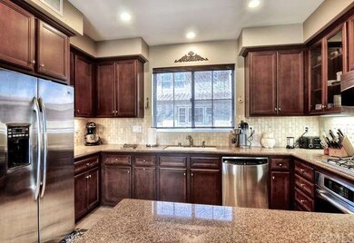 Stainless appliances, granite countertops, and cus