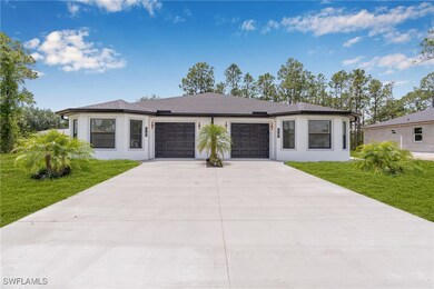Prairie-style home featuring concrete driveway, st