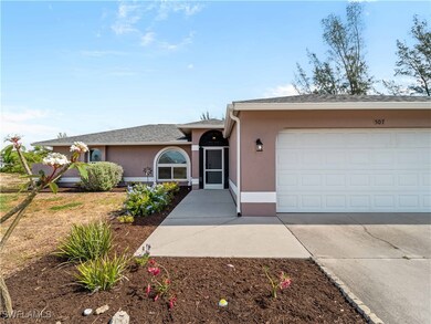 Single story home featuring an attached garage, st