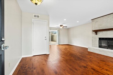Living room featuring engineered hardwood floors, 