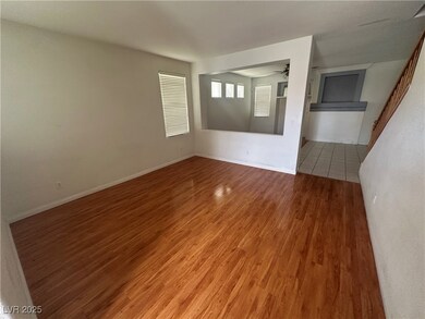 Spare room with ceiling fan, light wood-style floo