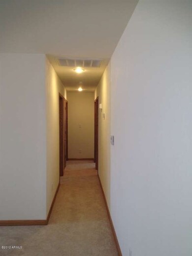 Hallway w/ recessed lighting