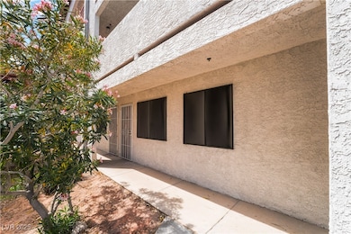 View of side of home featuring a patio area and st