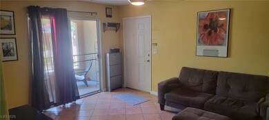 Living room featuring light tile patterned floorin