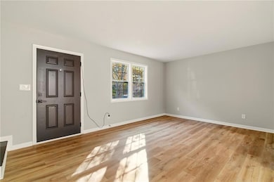 Entrance foyer featuring light wood finished floor