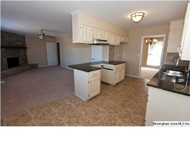 Kitchen features Granite Countertops, Tile Backspl