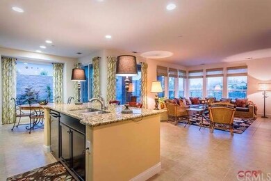 Open floorplan with large picture windows looking 