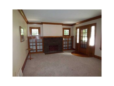 Living Room. Decorative fireplace flanked by built