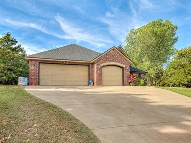 View of front facade with a garage and a front law