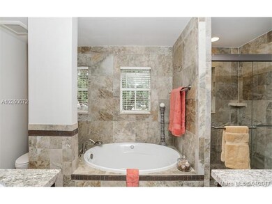 Jetted spa tub in the master suite.  Separate show