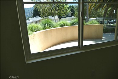 private patio with greens and view of hills