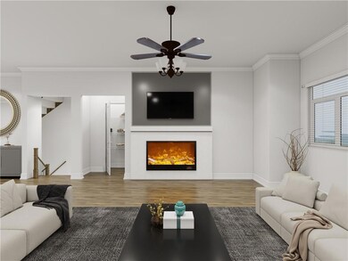 Living area featuring wood finished floors, ornamental molding, ceiling fan, and a lit fireplace
