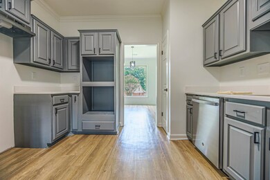 Kitchen featuring stainless steel dishwasher, orna