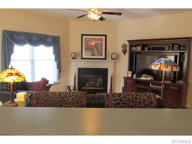 View of family room from the kitchen sink. The ope