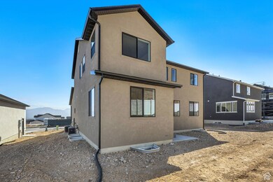 Rear view of house featuring stucco siding and a mountain view