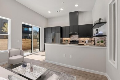 Kitchen with stainless steel appliances, open she