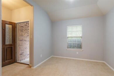 Unfurnished bedroom featuring vaulted ceiling and