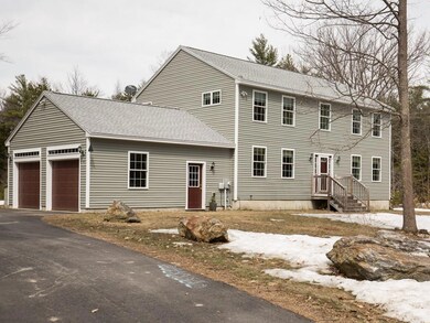 Two car garage and large lawn.