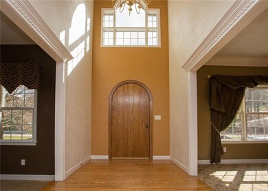 This dramatic two story foyer give this home a gra