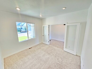 Unfurnished bedroom with carpet flooring and recessed lighting