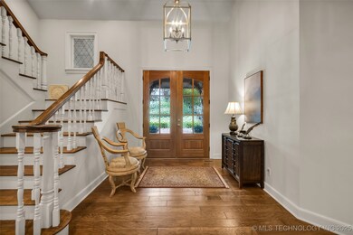 Foyer entrance with stairway, wood-type flooring,