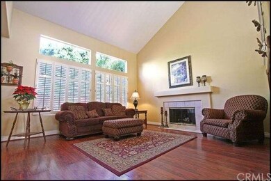Family room with vaulted ceilings and tile-accente