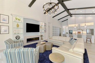 Fabulous built-in with glass shelving, lights and an electric fireplace.