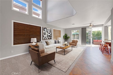 Love this virtually staged picture of what you could do with this living room! Spacious, high ceilings, and inviting view to the relaxing patio area!
