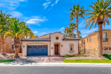Mediterranean / spanish-style home featuring a gar