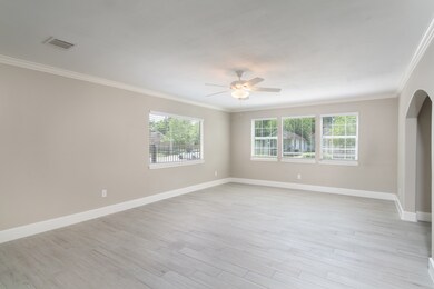 Supersized living room with crown molding, new pai