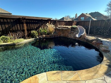 View of heated, salt water, swimming pool featurin